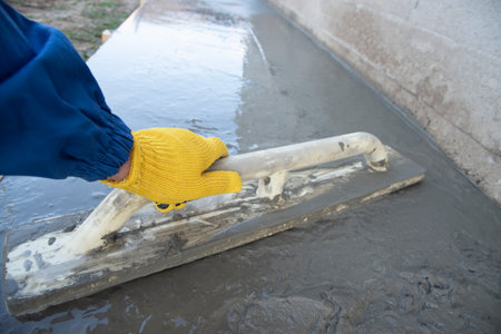 Mason leveling and screeding concrete floor baseの写真素材