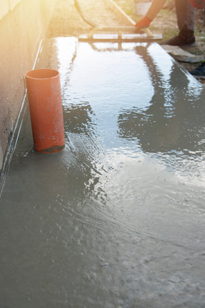 Mason leveling and screeding concrete floor baseの写真素材