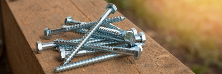 Timber screws . Fasteners for timber frames. Self-tapping screws, screws on a wooden beam.