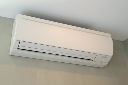 New Air Conditioner at a Grey Wallの写真素材