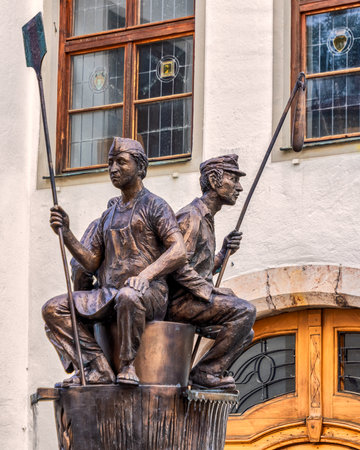 Sculpture of a man and a woman on the main square of the old town.のeditorial素材