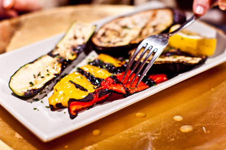 zucchini and peppers grilled eggplant on the grill and seasoned with salt olive oil and spicesの写真素材
