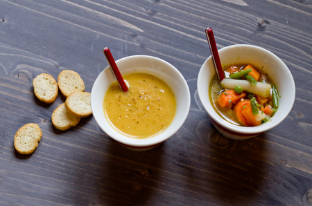 vegetable soup with carrots , green beans , potatoes , peas and onions into pieces and blend vegetablesの写真素材