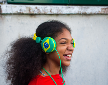 Brazilian girl with the happy brazil hat for the arrival of world sports festival,の写真素材