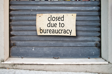 It lowered shutter of a closed company because of the bureaucracy that hinders the free initiativeの写真素材
