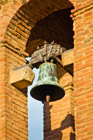 brick tower with bells ringing to tell the timeの写真素材
