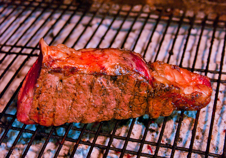 Grilled fillet steak on the fire of the barbeque grillの写真素材