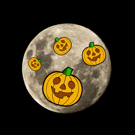 hallowen pumpkin in the dark night is set against the silhouette of the moonの写真素材