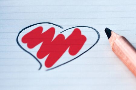 heart drawn with a pencil and colored with the color you love: redの写真素材