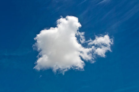 a white cloud in the blue sky