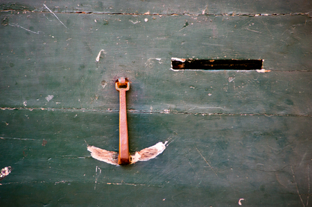 Closure of an old wooden door of a historic dwellingの写真素材