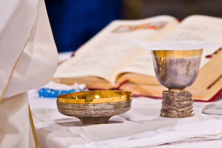 on the altar of the pyx and chalice mass they contain wine and hosts, blood and body of Christの写真素材