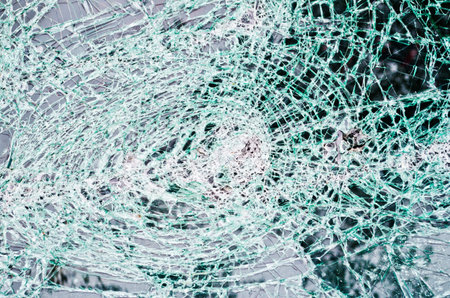 glass destroyed in thousands of cracks like a dense web of cuts