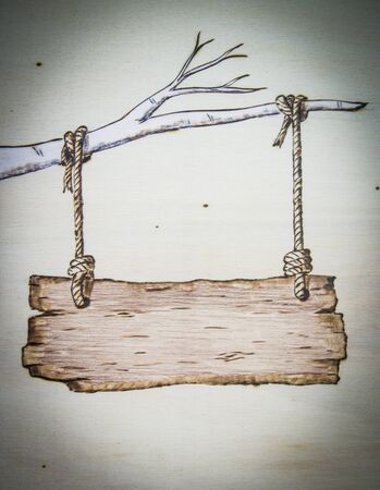 the ancient art of pyrography, wood and fire, with a sign to write your loveの写真素材