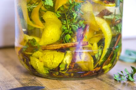 herbs and spices to macerate in alcohol, craftsman produces liqueur with herbs and aromatic spices from an ancient traditional recipeの写真素材