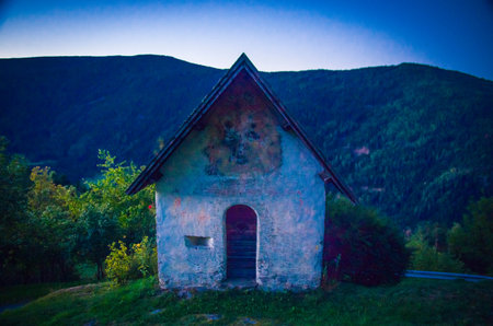 morning prayer in the small church of montangna with the rising sunの写真素材