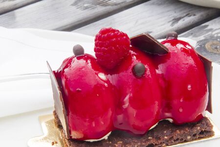 Bavarian cream with strawberry glaze and bitter chocolateの写真素材