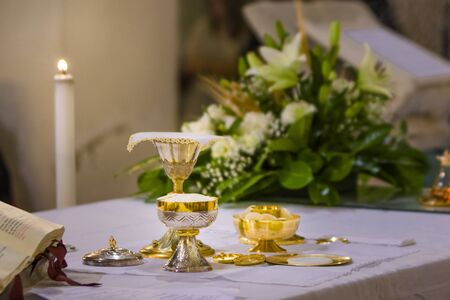 altar with consecrated host that becomes the body of jesus christ and chalice for wine, blood of christ, in the church of francesco papa in romeの写真素材