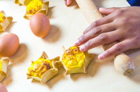 star-shaped cakes made with fresh eggs, shortcrust pastry, ricotta and creamの写真素材