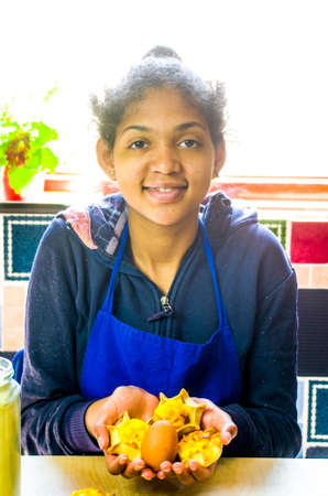 young girl cook cooks delicious pastries made with fresh eggs, ricotta and creamの写真素材