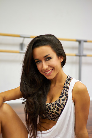 Smiling portrait of sexy brunette dancer girlの写真素材