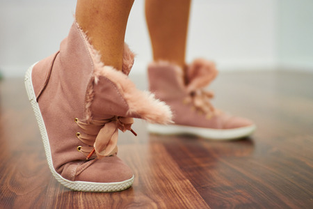 Close up of sport shoes in wood floorの写真素材