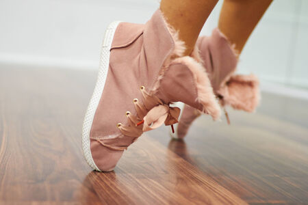 Close up of sport shoes in wood floorの写真素材