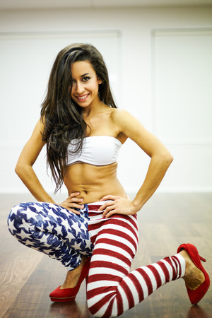 Smiling portrait of sexy brunette dancer girlの写真素材