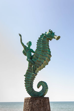 Photo of the seahorse statue otherwise known as "Caballeo del Mar" in Puerto Vallarta Mexico. This statue is located on the boardwalk or Malecon and was created in 1976 by Rafel Zamarripa. This public statue is one of Puerto Vallarta's most famous landmarの写真素材