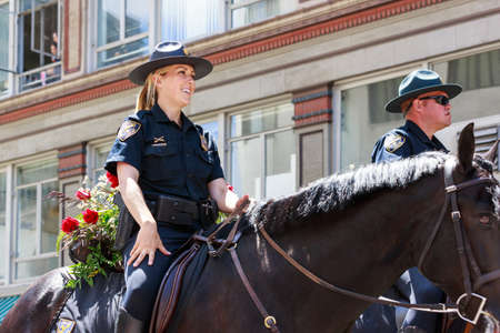 Portland, Oregon, USA - JUNE 7, 2014  Portland Police Mounted Patrol in Grand floral parade through Portland downtown のeditorial素材