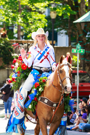 Portland, Oregon, USA - JUNE 7, 2014  Miss Vancouver Rodeo Queen, Amanda Knapp in Grand floral parade through Portland downtown のeditorial素材