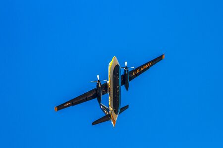 Hillsboro, Oregon - September 20, 2014: The C-31A Troopship of the US Army Golden Knights Parachute Team flies above at the Oregon International Air Show.のeditorial素材
