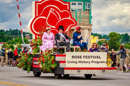 Portland, Oregon, USA - June 11, 2016: Portland Rose Festival Foundation Float featuring Living History Characters in the Grand Floral Parade during Portland Rose Festival 2016.のeditorial素材