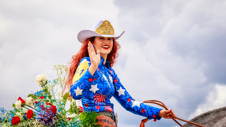 Portland, Oregon, USA - June 11, 2016: Miss Vancouver Rodeo, Cheyenne Ward in the Grand Floral Parade during Portland Rose Festival 2016.のeditorial素材