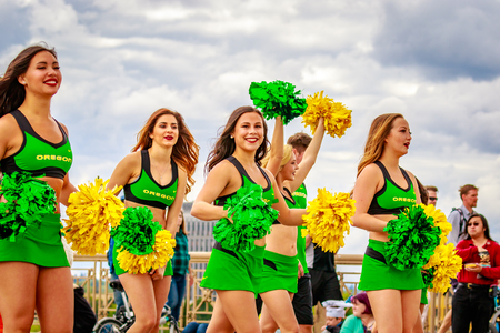 Portland, Oregon, USA - June 11, 2016: University of Oregon Duck Truck, Pep Band, Cheerleaders and Duck in the Grand Floral Parade during Portland Rose Festival 2016.のeditorial素材