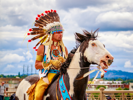 Portland, Oregon, USA - June 11, 2016: The Happy Canyon trail horse, Chinook and Bryson Bronson, his rider in the Grand Floral Parade during Portland Rose Festival 2016.のeditorial素材
