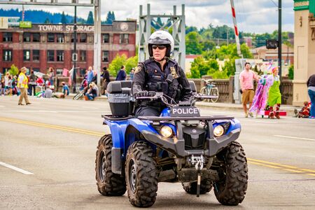 Portland, Oregon, USA - June 11, 2016: Portland Police Bureau in the Grand Floral Parade during Portland Rose Festival 2016.のeditorial素材