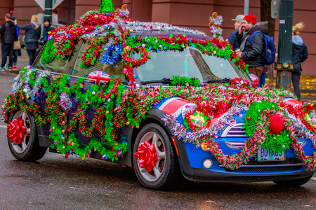 Portland, Oregon, USA - November 25, 2016: Decorated mini cooper in the annual My Macy's holiday Parade across Portland Downtown.のeditorial素材