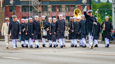 Portland, Oregon, USA - June 10, 2017: Navy Band Northwest in the Grand Floral Parade, as it stretched through the rain, during Portland Rose Festival 2017.のeditorial素材