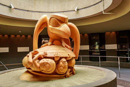 The yellow cedar sculpture The Raven and the First Men by Bill Reid, in Museum of Anthropology at University of British Columbiaのeditorial素材