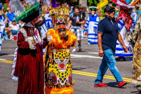 Portland, Oregon, USA - June 10, 2023:  Comparsa Orgullo Morelense Cemiac heritage group in the Grand Floral Parade, during Portland Rose Festival 2023.のeditorial素材