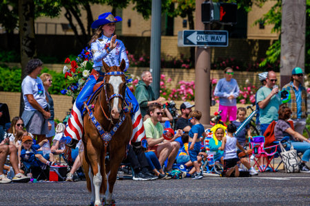 Portland, Oregon, USA - June 10, 2023: Coos County Fair & Rodeo Queen, Paige Train, in the Grand Floral Parade, during Portland Rose Festival 2023.のeditorial素材