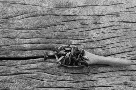 rice in a cup on wood backgroundの写真素材