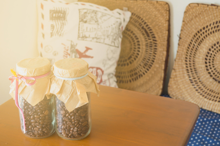 coffee bean in cup on the soft light with vintage stlysの写真素材