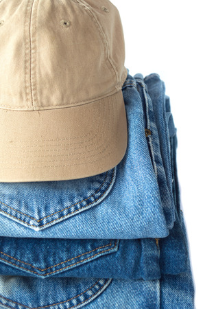stack of blue jeans on white backgroundの写真素材