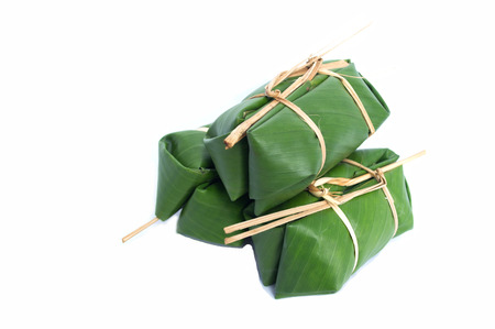 glutinous rice steamed in banana leaf  isolated backgroundの写真素材