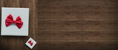 Gift for new year,birthday,valentine concept on wood background view above with copy space.の写真素材