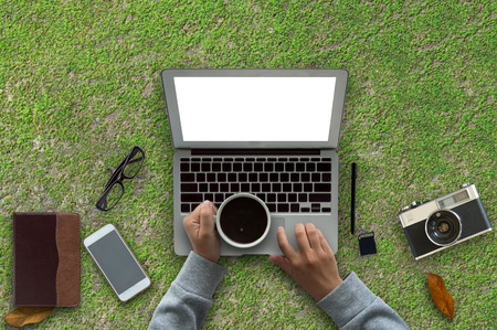 Office wood table with computer,coffee cup.Copy space.の写真素材