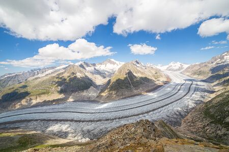 Majestic view to Aletsch glacier, the largest gracier in Alps and UNESCO herritage from Bettmeralp, Valais, Switzerland, Europe. The glacier reduction is very visibleの写真素材