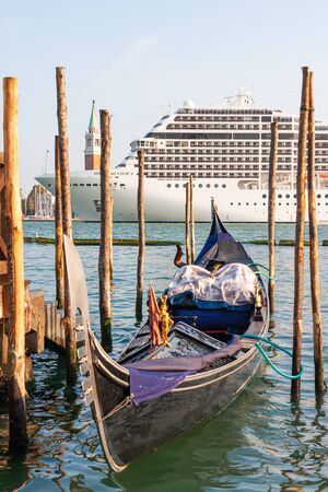VENICE, ITALY - September 17, 2011: The cruise ship MSC Magnifica crosses the Venetian Lagoon near the gondolas.のeditorial素材